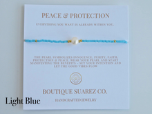 Load image into Gallery viewer, Rena Pearl Peace & Protection Carded Bracelet