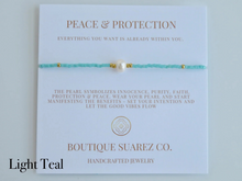 Load image into Gallery viewer, Rena Pearl Peace & Protection Carded Bracelet