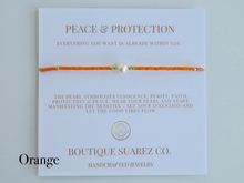 Load image into Gallery viewer, Rena Pearl Peace & Protection Carded Bracelet